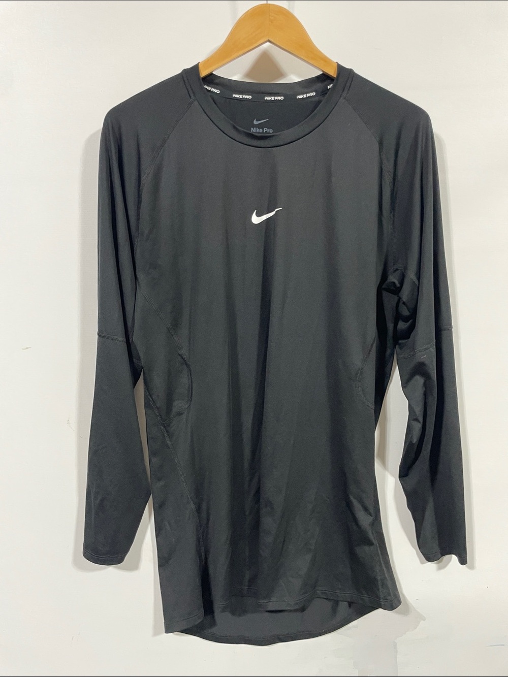 Nike Black Long Sleeve Performance Top with White Swoosh